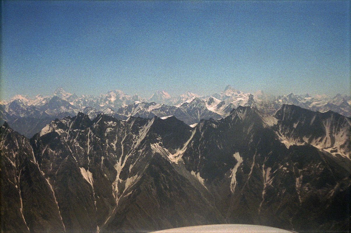 12 K2, Broad Peak, Gasherbrum IV, Gasherbrum I, Masherbrum On Flight From Islamabad To Skardu I can see a very large mountain in the hazy distance poking above the intervening mountains � K2! To the right of K2 is Broad Peak, the Gasherbrums, and to the right Masherbrum.